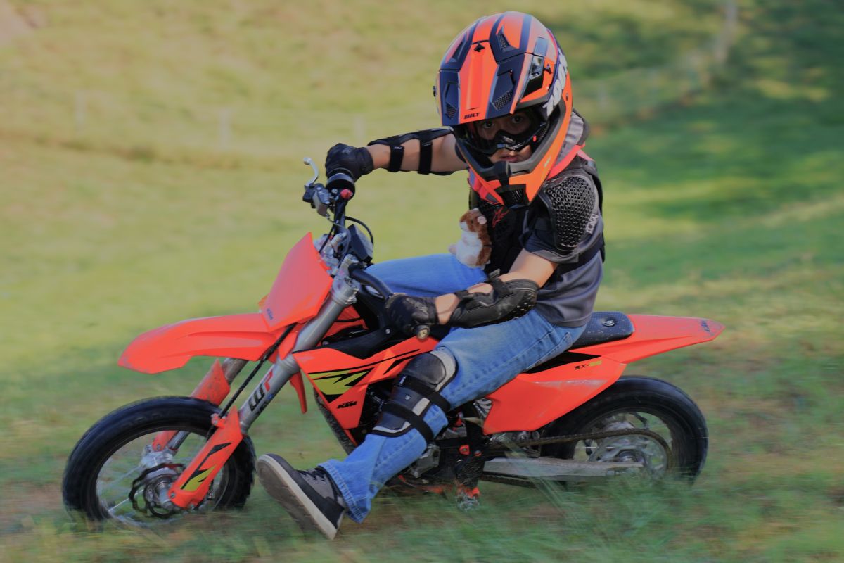 Eight-year-old riding a KTM SX-E 5 motorcycle